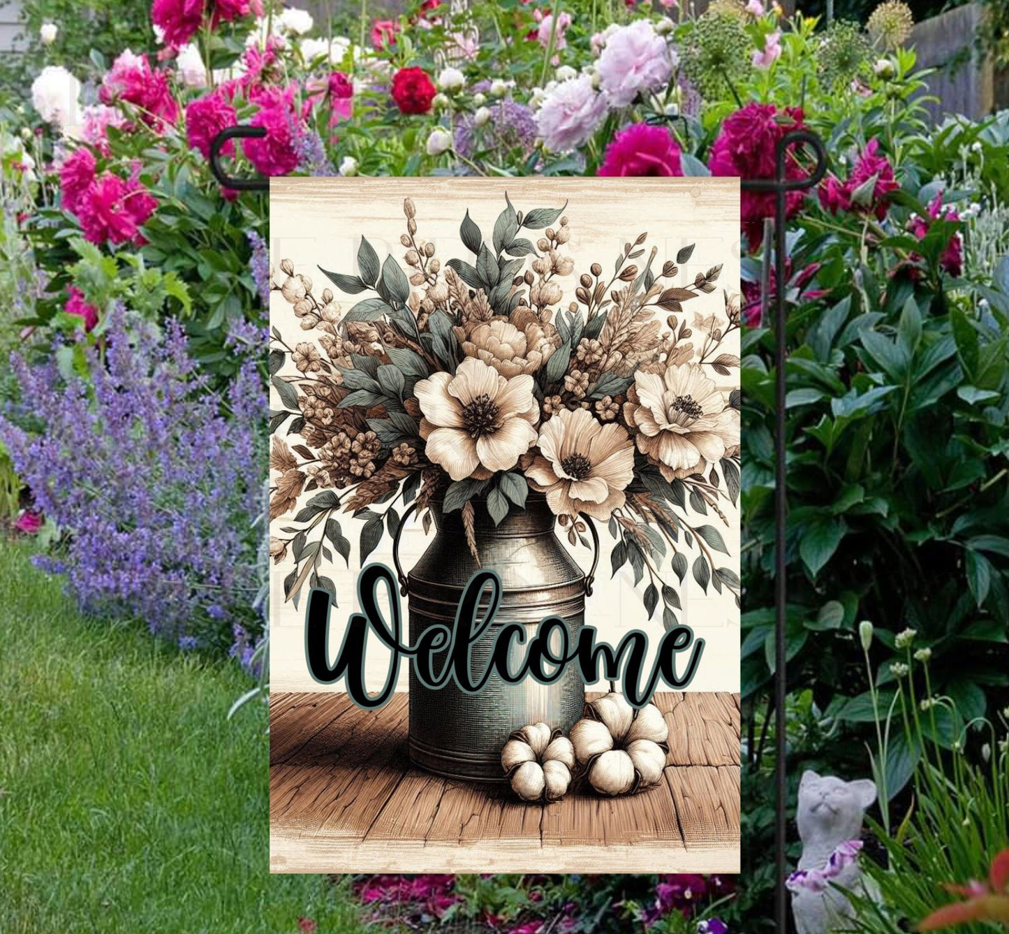 This beautiful double-sided Garden Flag features a rustic farmhouse scene with a metal milk can full of Magnolias, cotton bolls and other flowers with a Welcome message.