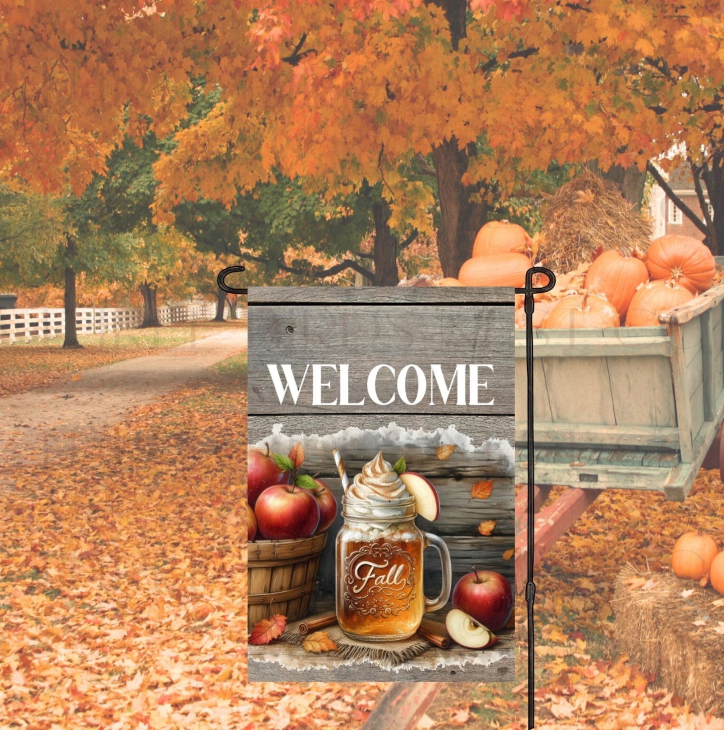 A beautiful Fall Welcome Garden Flag with a basket of apples and a mason jar full of apple cider.