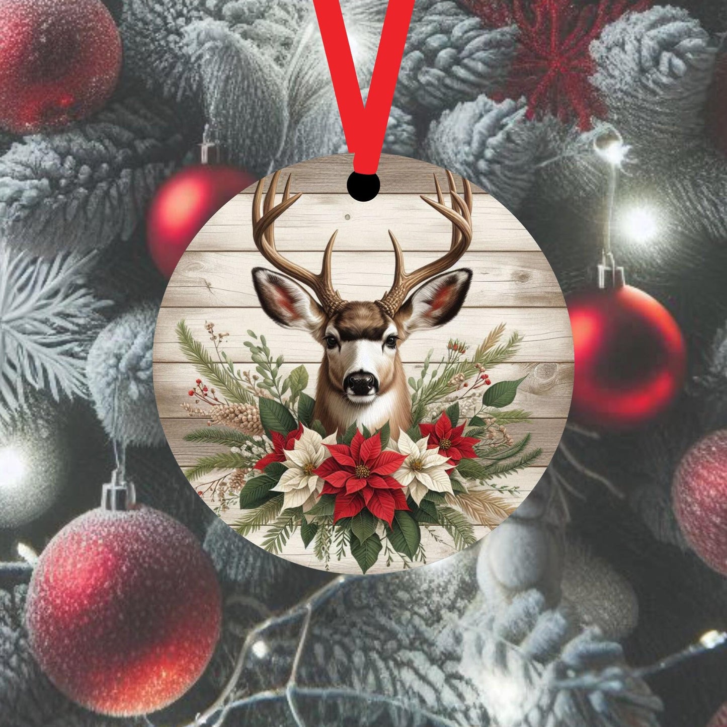 A Mule Deer accented with red and white Poinsettia flowers on a wood look background.