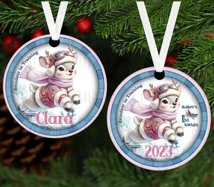 An adorable Christmas Ornament with a watercolor Reindeer girl in pink.