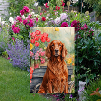 A beautiful Irish Setter dog surrounded by gorgeous flowers.