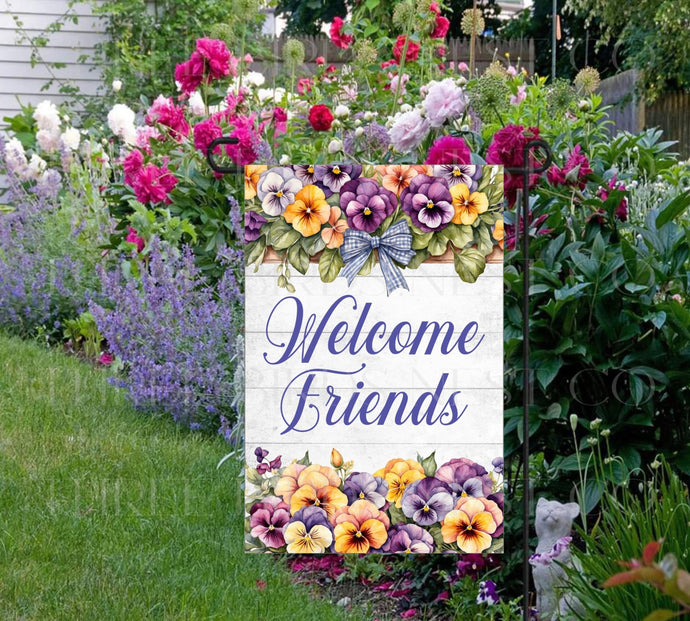 A beautiful Welcome Friends Garden Flag featuring brightly colored Pansy flowers and a gingham bow.