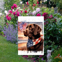 An adorable Chocolate Labrador Retriever Dog wearing an American Flag Bandanna on a Beach with Fireworks in the background.