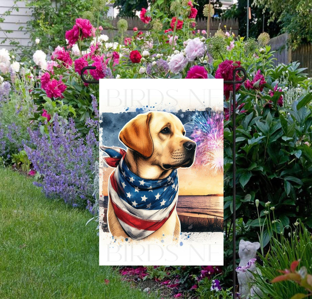 An adorable yellow Labrador Retriever Dog wearing an American Flag Bandanna on a Beach with Fireworks in the background.