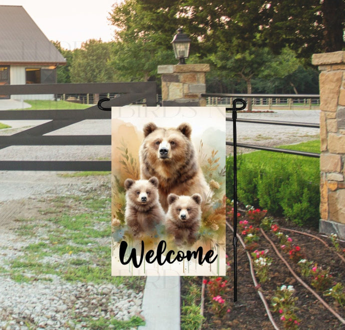 A beautiful woodland Welcome scene with a mama Grizzly Bear and her Beat Cubs.