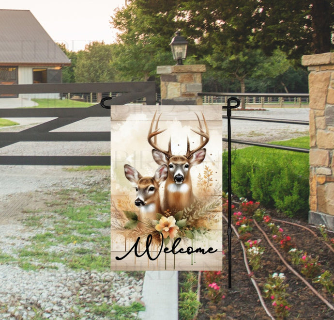 A beautiful woodland Welcome scene with a buck and doe Whitetail Deer.