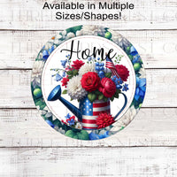 A beautiful Home Wreath Sign with a Patriotic Watering can full of red, white and blue flowers for your 4th of July decor. Dahlias, roses and blue bell flowers with an American Flag.