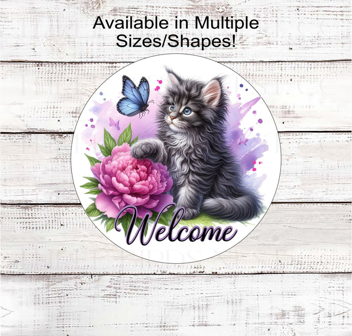 An adorable Maine Coon kitten/cat paws at a butterfly and a beautiful peony flower with purple accents.