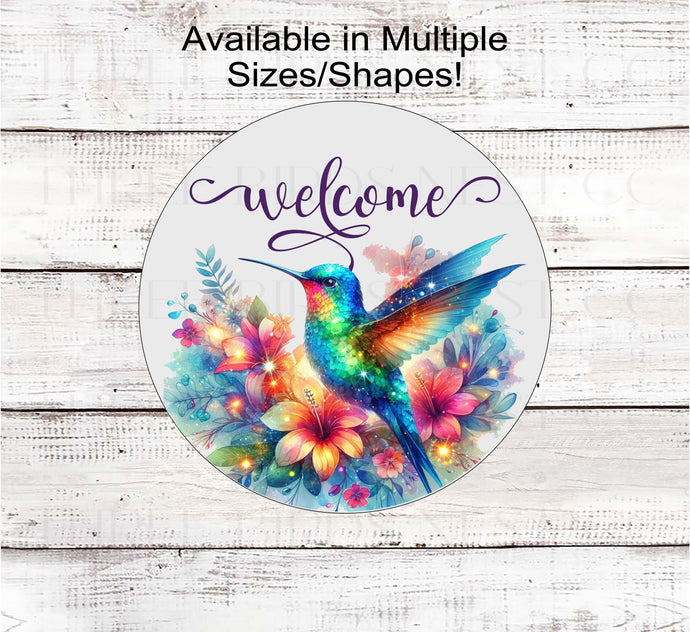 A beautiful Hummingbird surrounded by flowers in bright rainbow colors with a Welcome message.