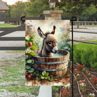 An adorable farm scene with a baby Donkey taking a bath in a wooden tub with farm fresh strawberries around the tub.