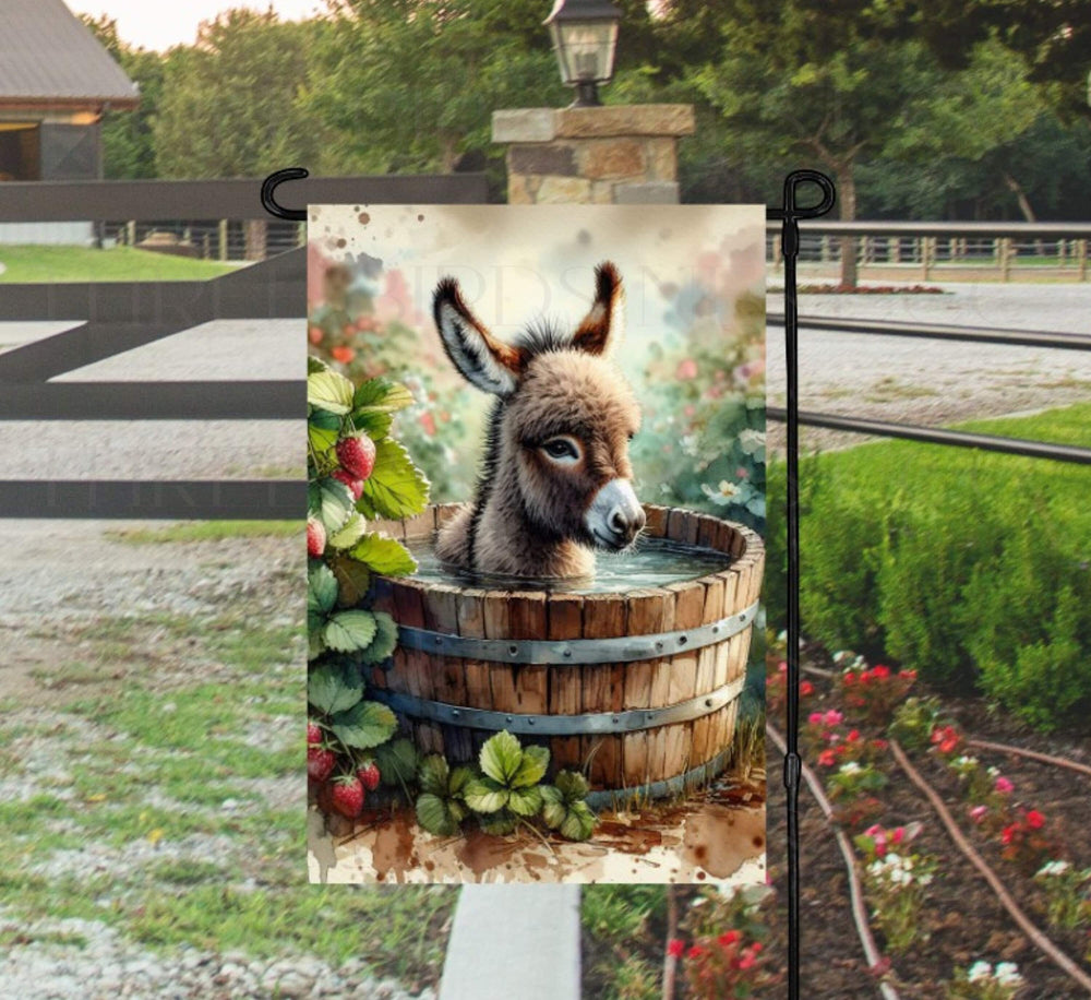 An adorable farm scene with a baby Donkey taking a bath in a wooden tub with farm fresh strawberries around the tub.