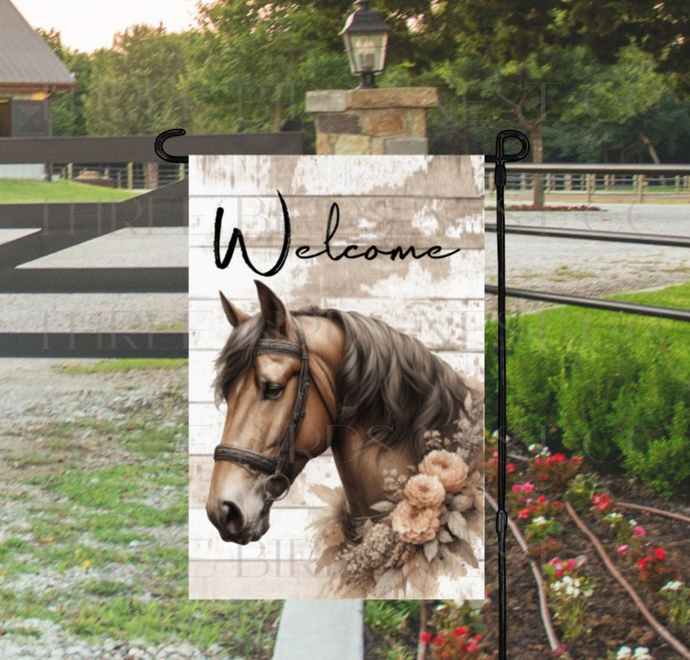 A beautiful brown horse with a collar of greenery and peach flowers on a rustic wood background.