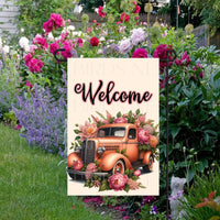 A beautiful peach colored vintage old truck full of Spring flowers.