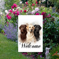 A beautiful Welcome Garden Flag with a trio of Labrador Retriever dogs.