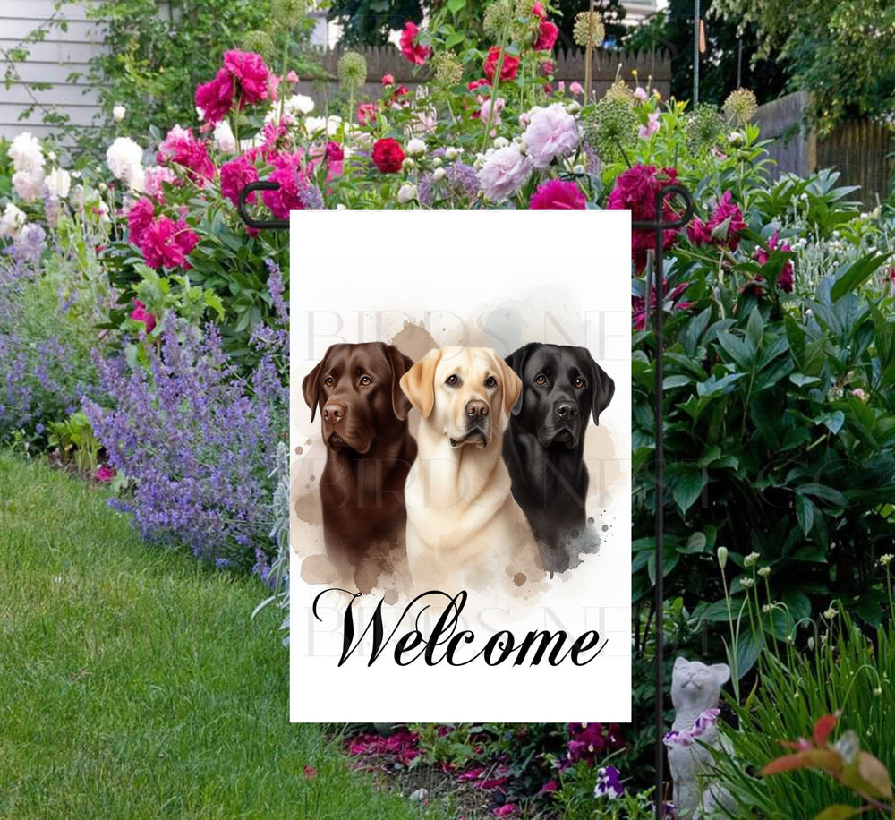 A beautiful Welcome Garden Flag with a trio of Labrador Retriever dogs.