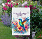 A Welcome Garden Flag with brightly colored flowers and Hummingbird.