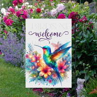 A Welcome Garden Flag with brightly colored flowers and Hummingbird.