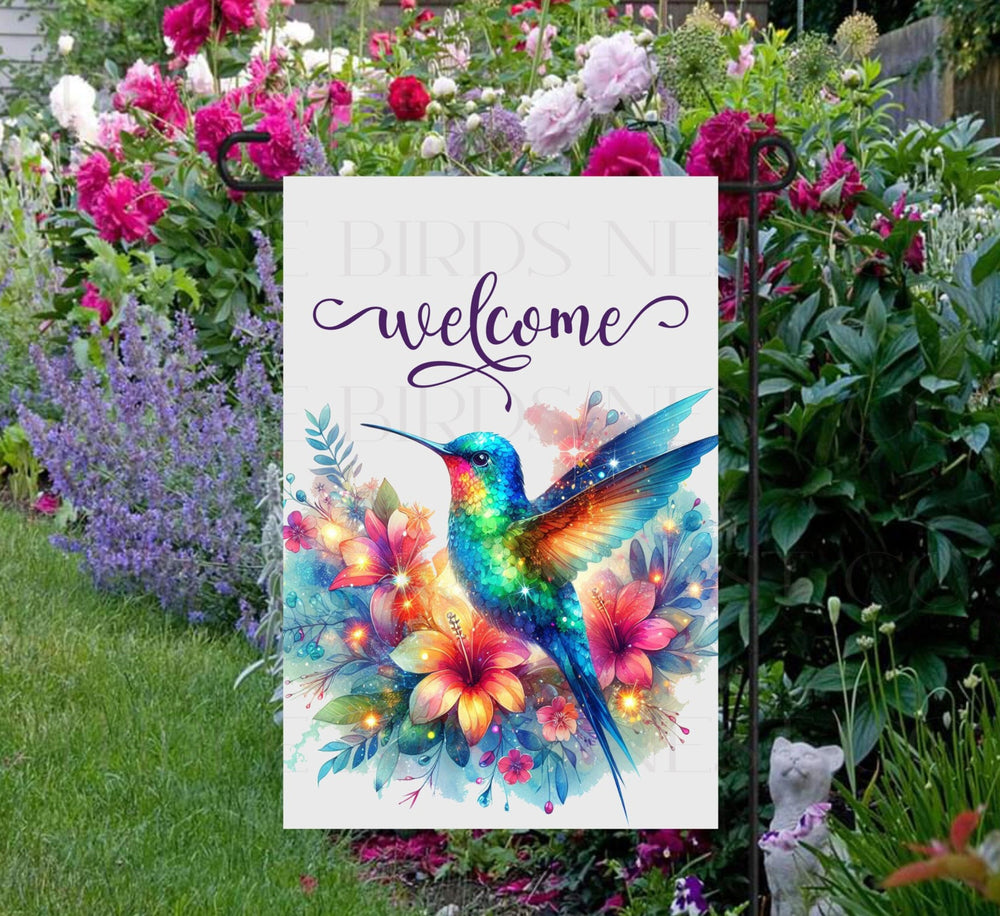 A Welcome Garden Flag with brightly colored flowers and Hummingbird.