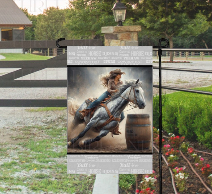 A horse girl barrel racing on a beautiful grey dapple horse.