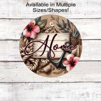 A beautiful Beach Home Sign with an anchor, pineapples and hibiscus flowers.