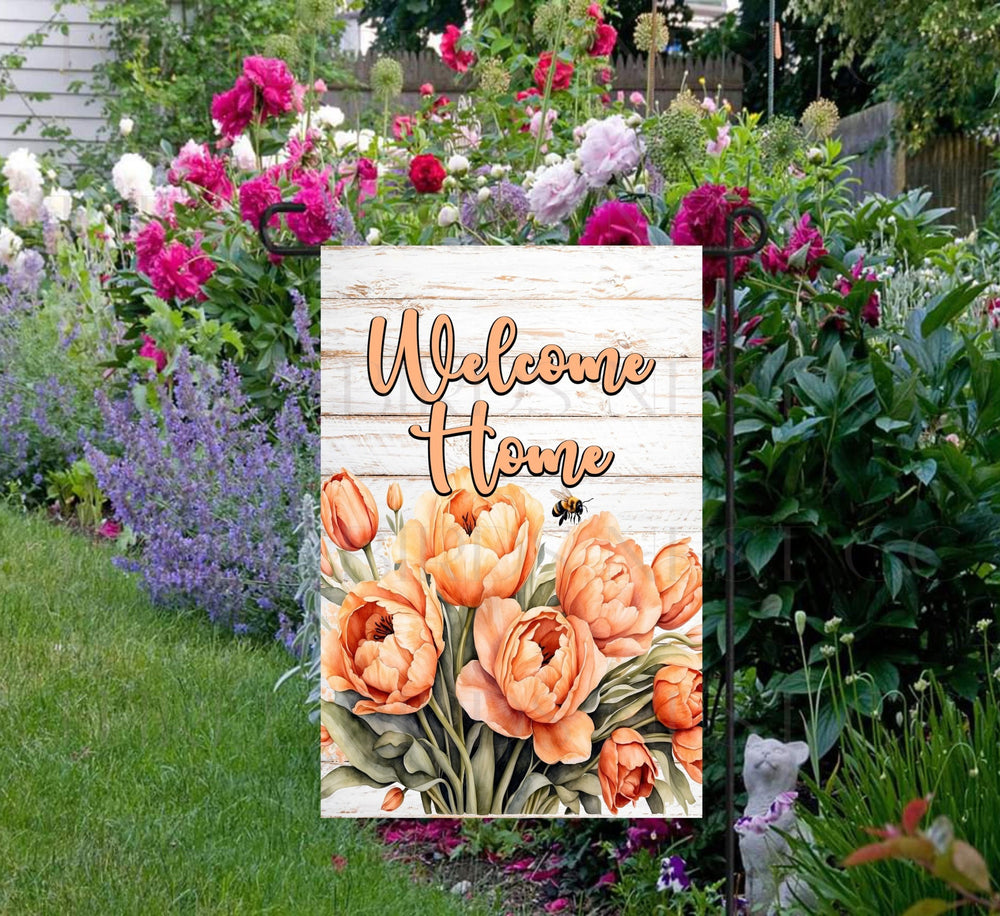 A beautiful Welcome Home Garden Flag featuring Pantone Peach Colored Tulips and Bumble Bees.