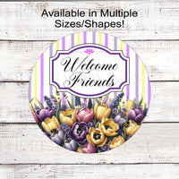 A Welcome Friends Wreath Sign with beautiful purple and yellow tulips.