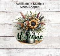 
              A beautiful rustic metal milk can filled with Sunflowers and other flowers and greenery with a Welcome message.
            