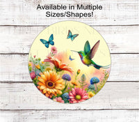 
              A vibrant wreath sign featuring a Hummingbird and Butterflies with beautiful flowers.
            