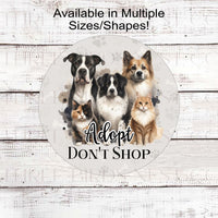 Adopt Dont Shop Wreath Sign with adorable dogs and cats on a pawprint background.