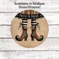 An adorable vintage look Halloween sign that features primitive Witch Legs and Shoes with a dress that says Trick or Treat.