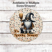 An adorable Witch Gnome with his broom and black cat are here to celebrate Spooky Season on a vintage Halloween stars background.