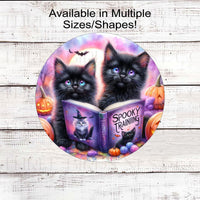 An adorable pair of black cats are here to celebrate Spooky Season!