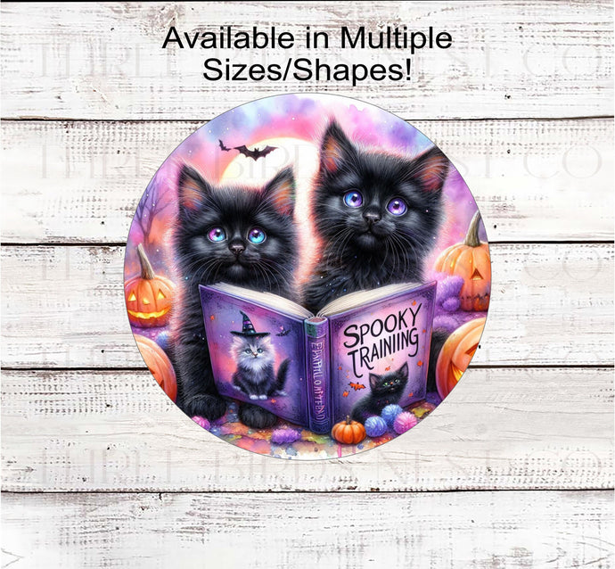 An adorable pair of black cats are here to celebrate Spooky Season!