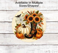 
              A beautiful Fall and Halloween Scene with a fancy Witch Boot filled with Sunflowers along with a spider web, a bat and white and orange Pumpkins.
            