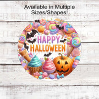 An adorable Halloween Wreath Sign filled with pastel candy, ice cream, and cupcakes with a jack-o-lantern and bats.