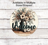 
              A beautiful rustic metal milk can filled with Magnolia flowers and other flowers and greenery with a Welcome message.
            