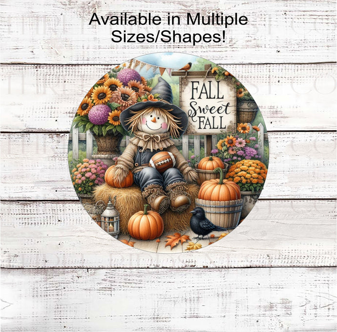 Fall Sweet Fall with an adorable Scarecrow surrounded by pumpkins, mums and sunflowers and holding a football.