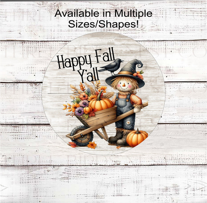 Its Fall Yall! A beautiful Fall Wreath Sign featuring an adorable Scarecrow pushing a wheelbarrow filled with pumpkins, sunflowers and Fall leaves and florals.