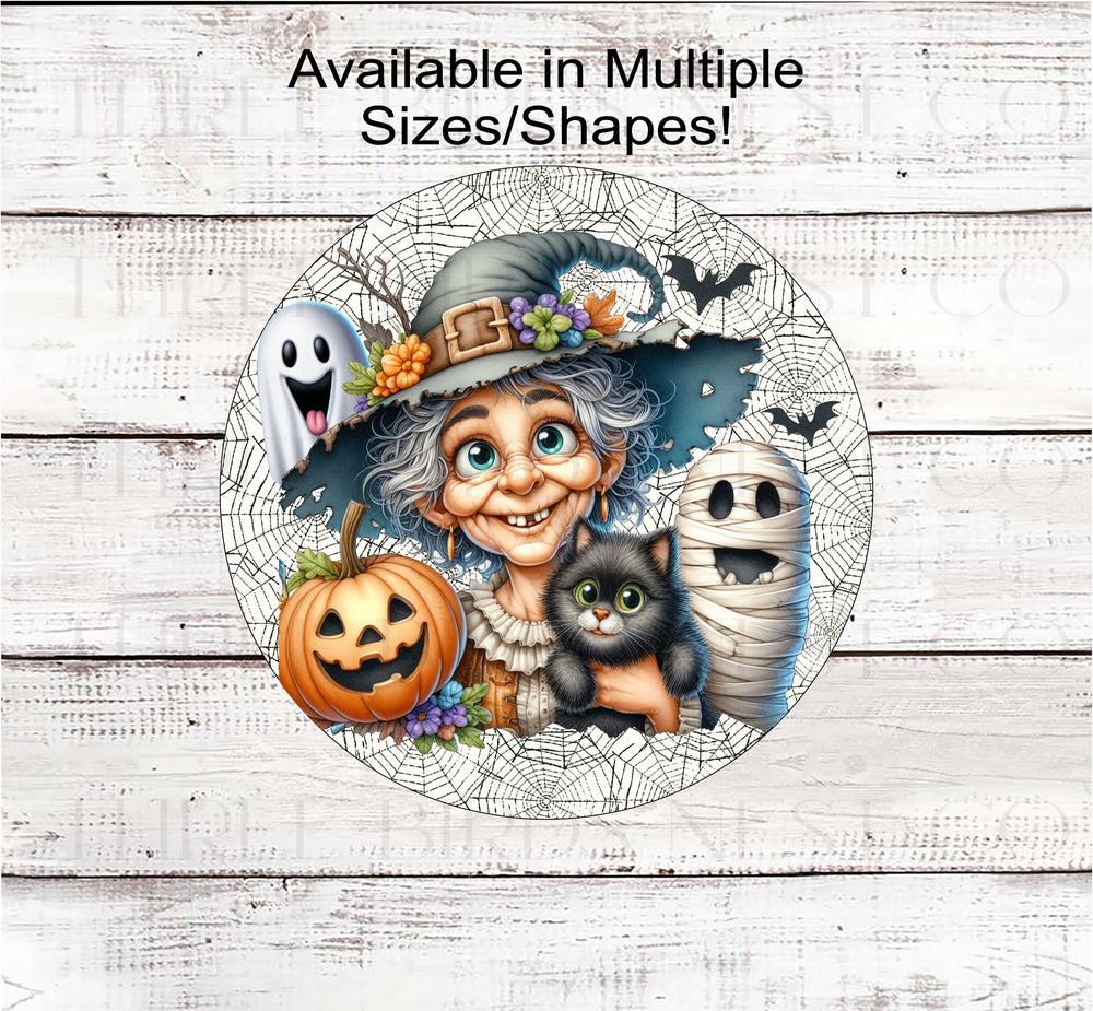 An adorable old Witch with her Halloween Friends- a black Cat, a Mummy, a Jack-O-Lantern and a cute Ghost- all on a spider webs background.