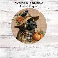 An adorable Leonberger puppy dog in a scarecrow hat with his black crow friend.