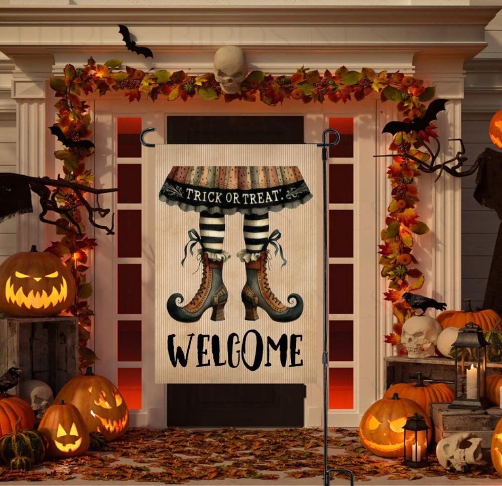 An adorable Halloween Garden Flag featuring a primitive pair of Witch Legs with a Trick or Treat and Welcome message.