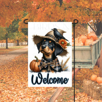 An adorable Black and Tan Doberman Pinscher Puppy Dog dressed as a Scarecrow with a Welcome Fall message.