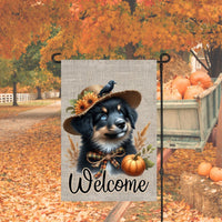 An adorable Australian Shepherd Puppy Dog dressed as a Scarecrow with a Welcome Fall message.