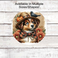 An adorable Australian Shepherd dog dressed as a Fall Scarecrow.