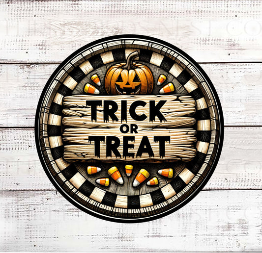 A Trick or Treat sign with Candy Corn and and Jack O Lantern