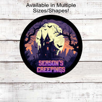 A Haunted House with Purple that says &quot;Season&#39;s Creepings&quot;