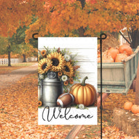 A beautiful primitive Welcome Garden Flag with a milk can full of sunflowers with a Football and a Pumpkin on a white wood-look background.