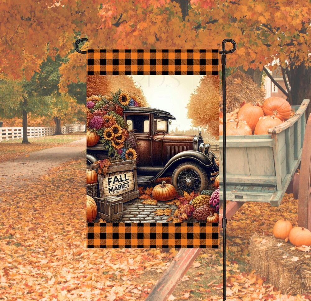 A beautiful Fall Market Garden Flag with a vintage old Truck will with Fall Sunflowers and foliage, with pumpkins and Mums.