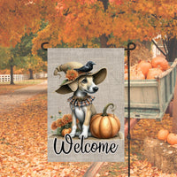 An adorable Greyhound Puppy Dog dressed as a Scarecrow with a Welcome Fall message.