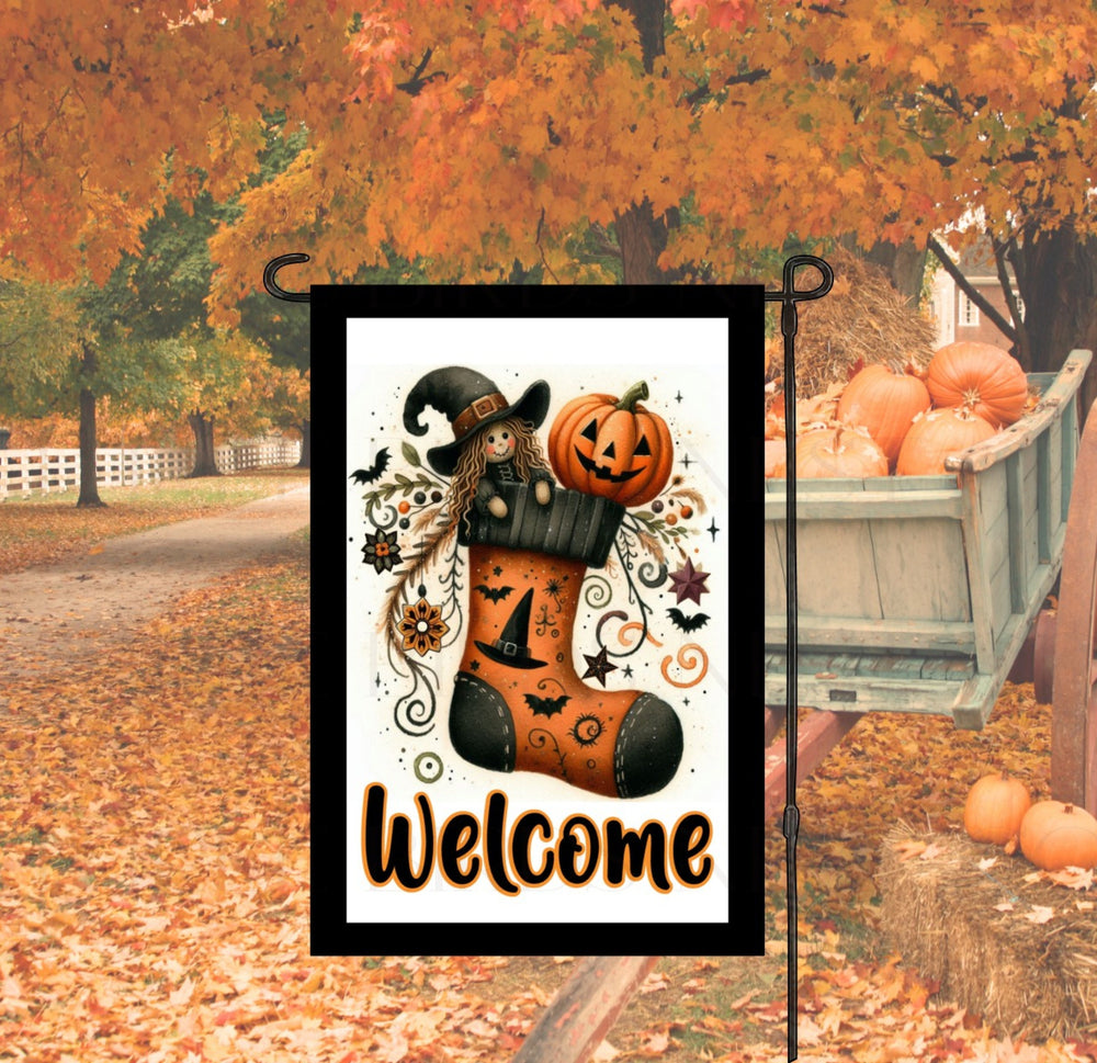 A perfect Halloween Garden Flag featuring an adorable Witch and Jack O Lantern in a decorated stocking.